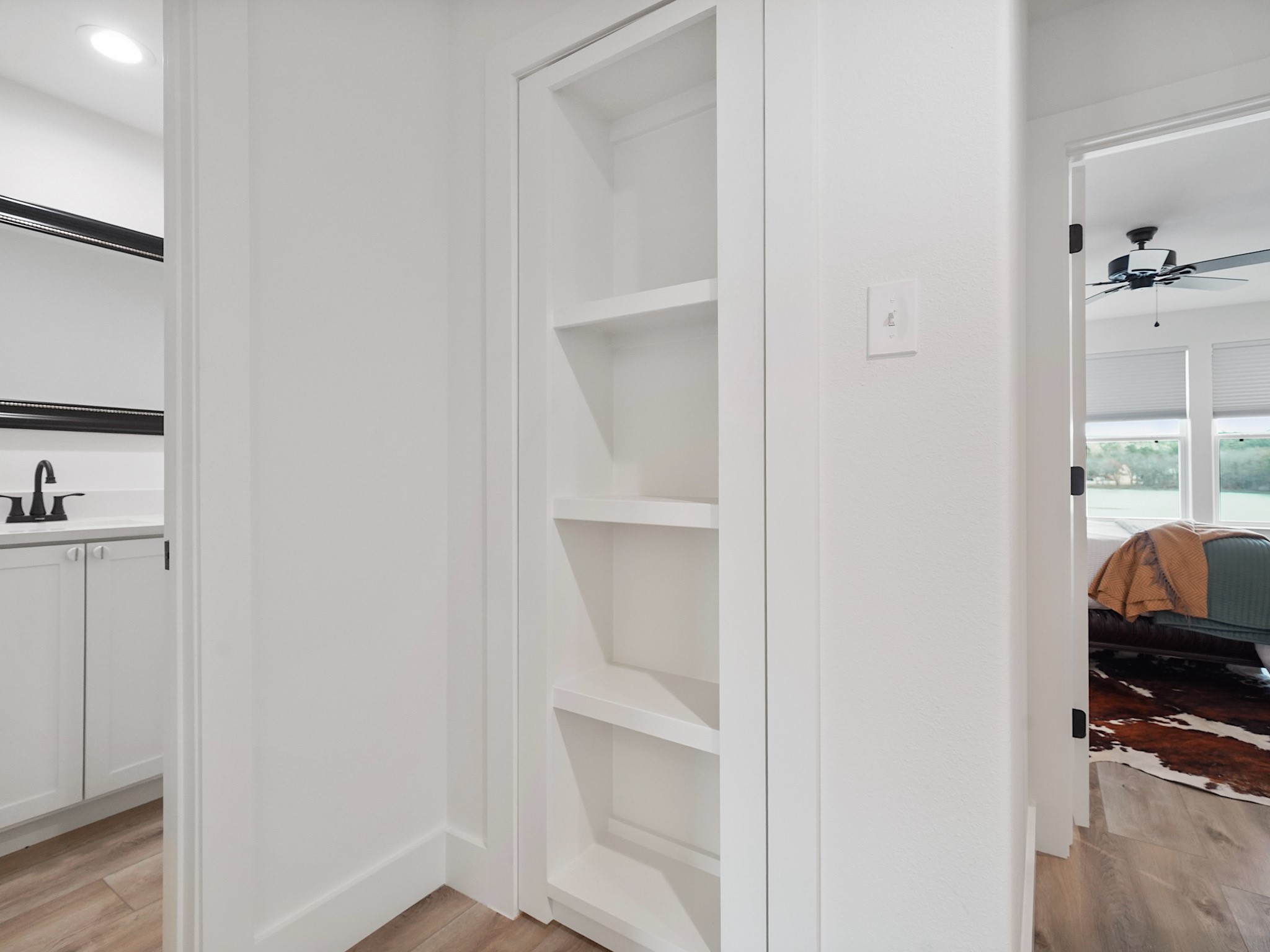 89 Cypress Bend Huntsville, TX 77340 - Photo 27 of 38 Bookcase is upstairs and swings open for storage