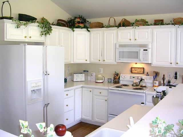 640 Deacon Ridge Street Wake Forest, NC 27587 - Photo 3 of 9 This is the sunny kitchen that faces the wall of windows and cozy fireplace in the warming room/breakfast nook area. The Kitchen and sunroom have a vaulted ceiling that adds to the open feeling. Other