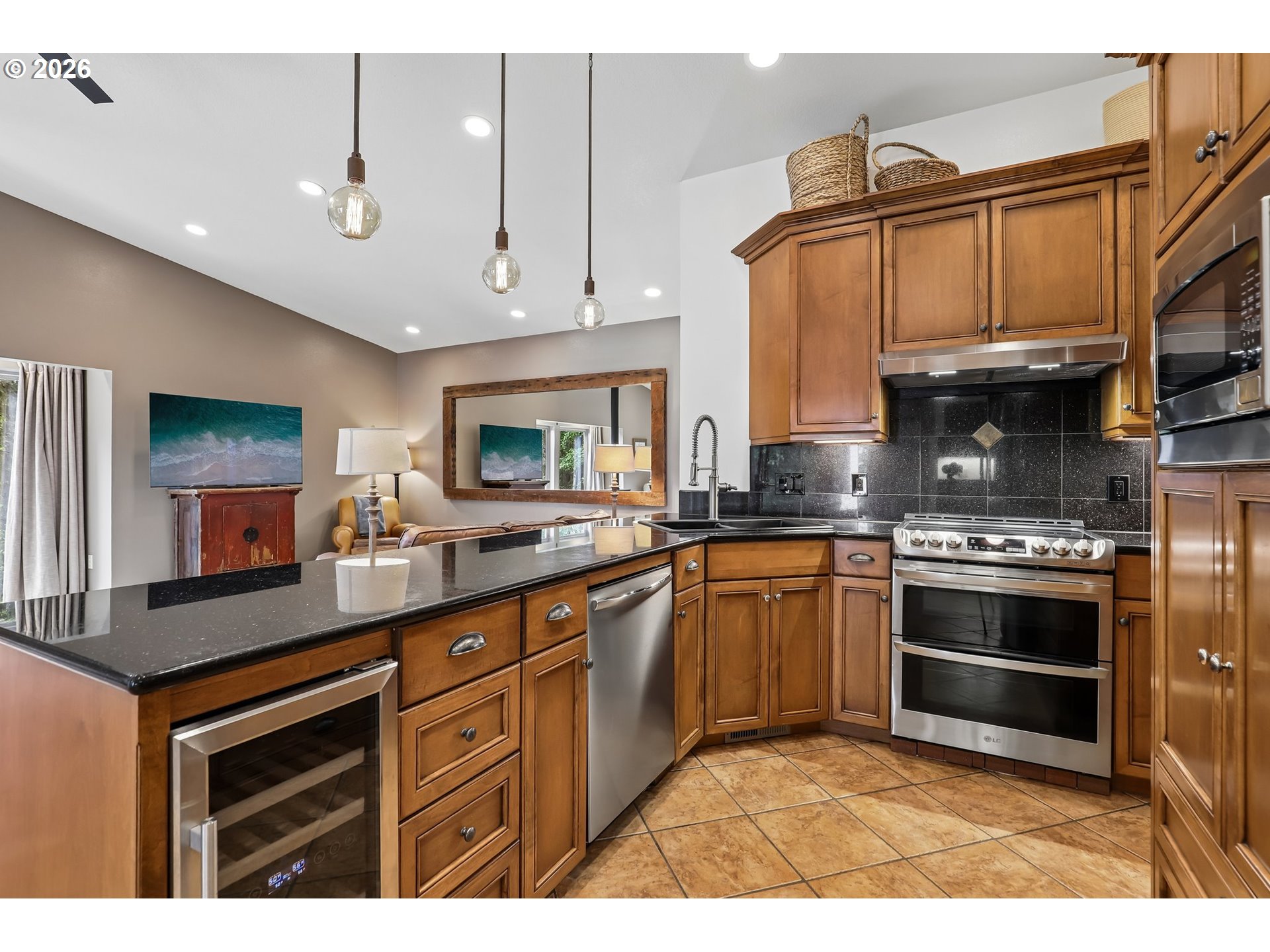 873 Mountain View Road Kalama, WA 98625 - Photo 18 of 45 a kitchen with stainless steel appliances granite countertop a stove a sink and a microwave