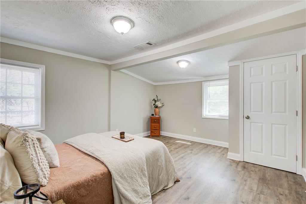 411 Ash Street Monroe, GA 30655 - Photo 17 of 36 a bedroom with a bed and a window