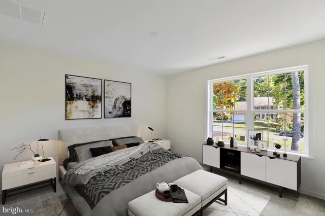 a bedroom with a bed and a couch