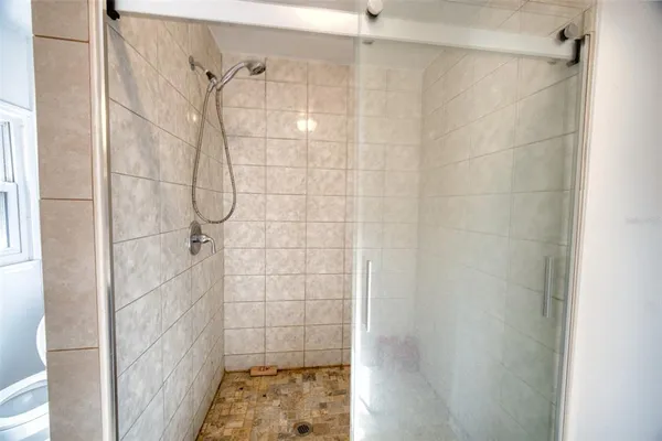 a kitchen with stainless steel appliances granite countertop a refrigerator and a stove