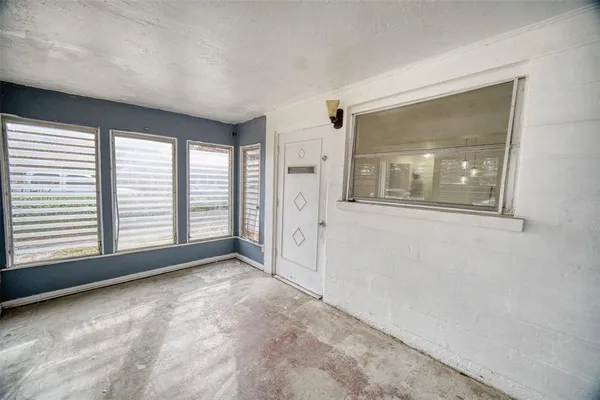 a view of a room with a large window