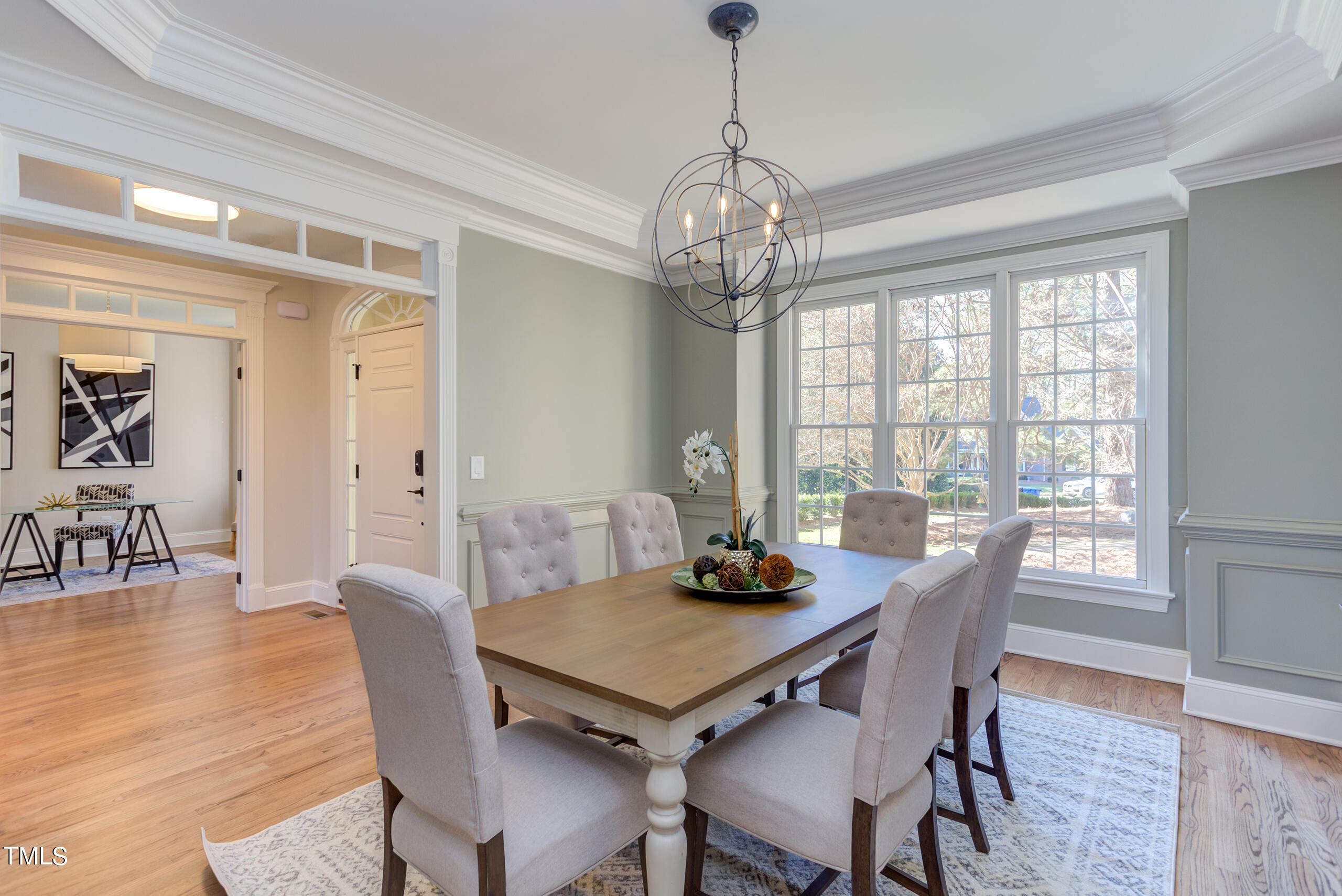 737 Loch Highlands Drive Raleigh, NC 27606 - Photo 11 of 85 a view of a dining room with furniture window and wooden floor