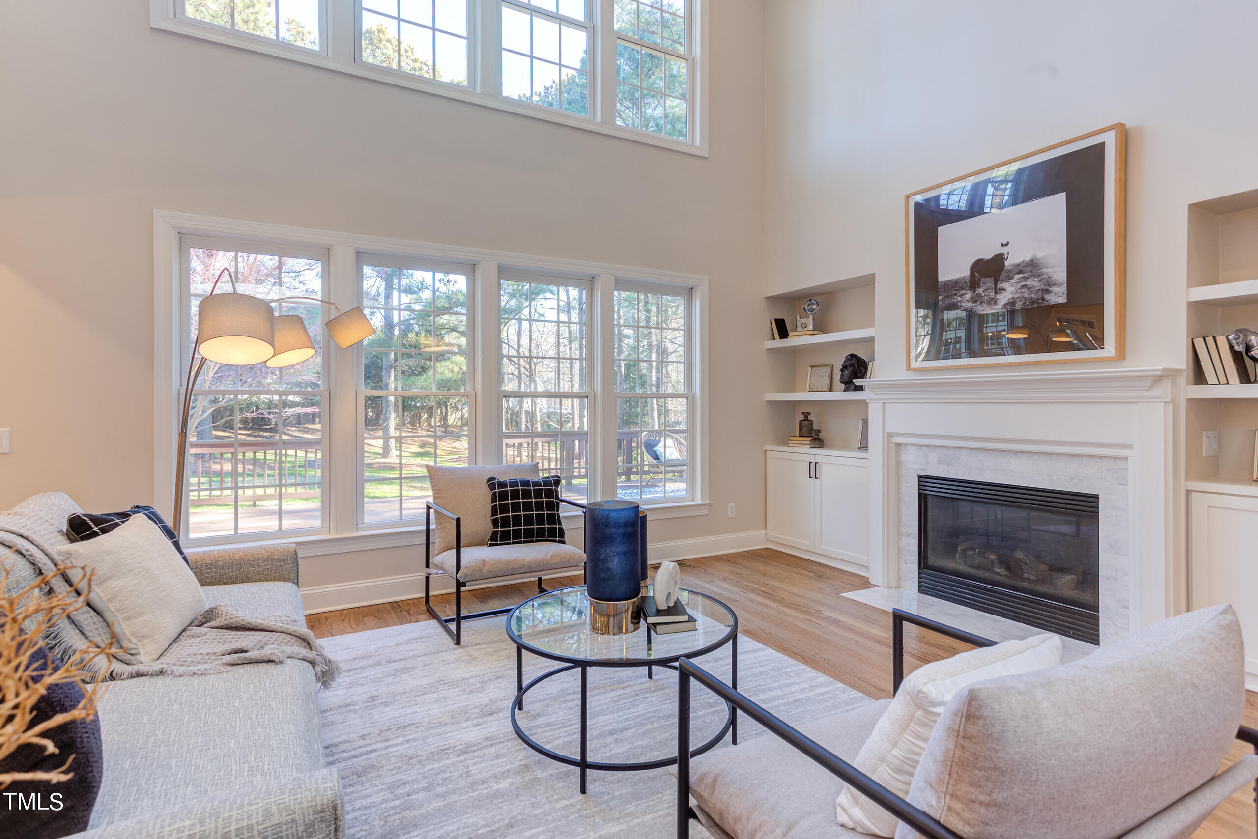 737 Loch Highlands Drive Raleigh, NC 27606 - Photo 14 of 85 a living room with furniture large window and fireplace