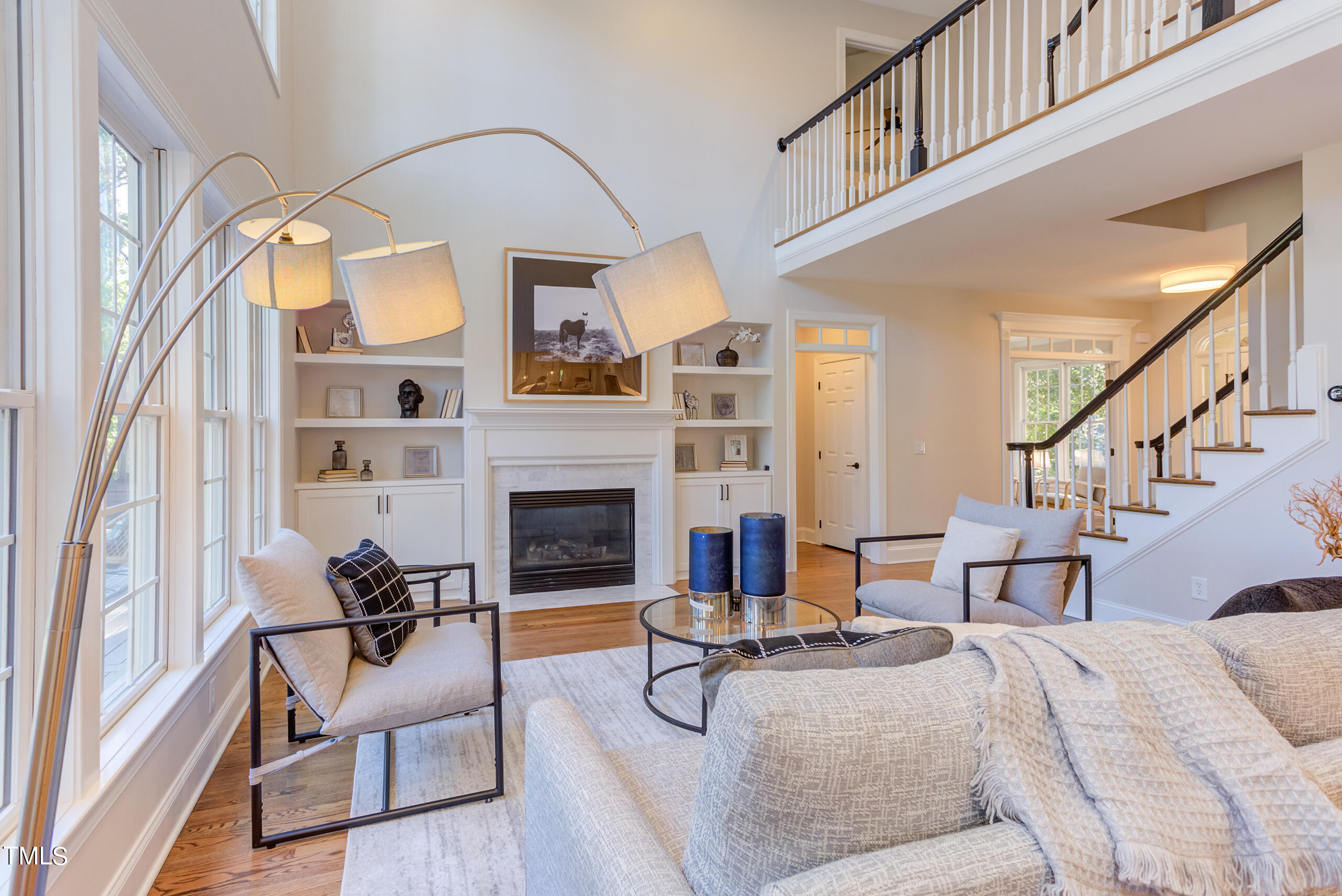 737 Loch Highlands Drive Raleigh, NC 27606 - Photo 16 of 85 a living room with furniture fireplace and a large window