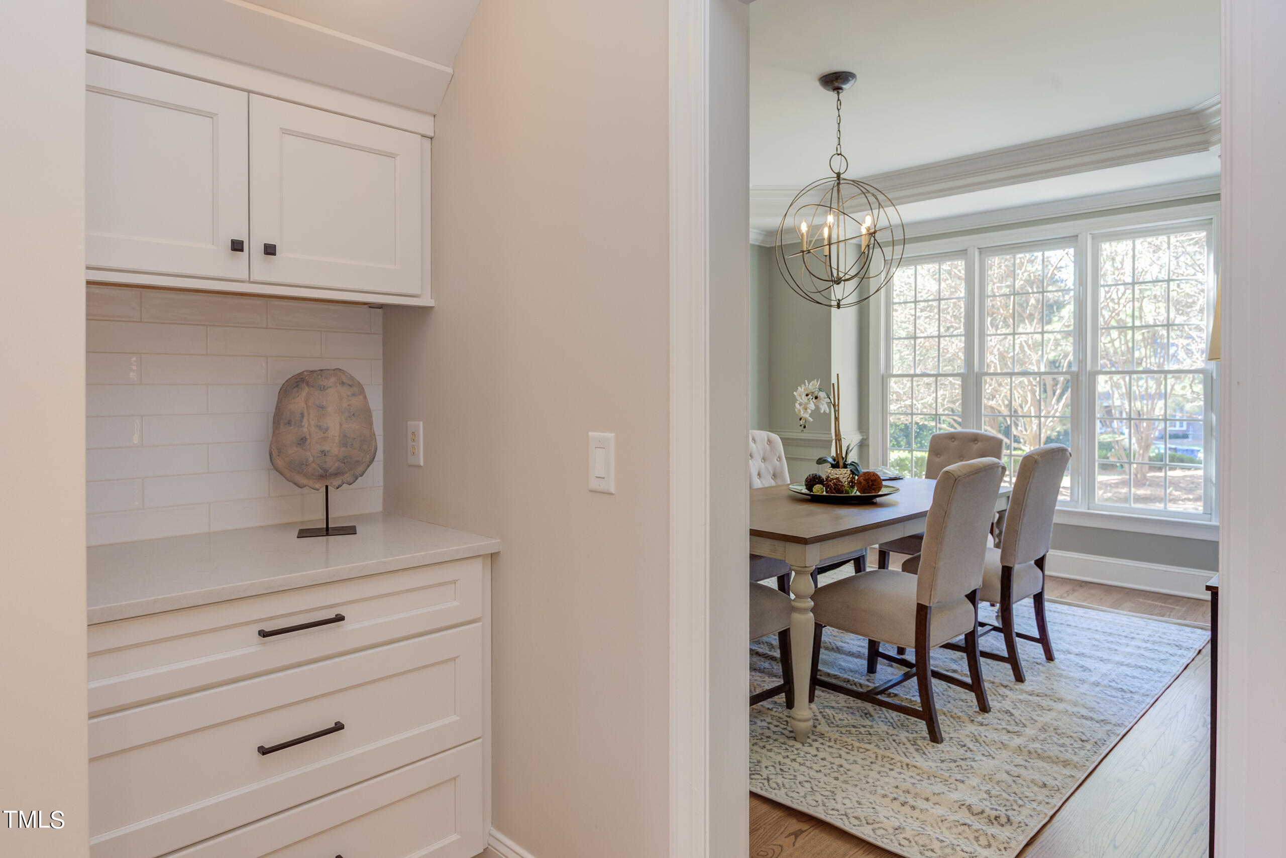737 Loch Highlands Drive Raleigh, NC 27606 - Photo 29 of 85 a view of a dining room with furniture window and outside view