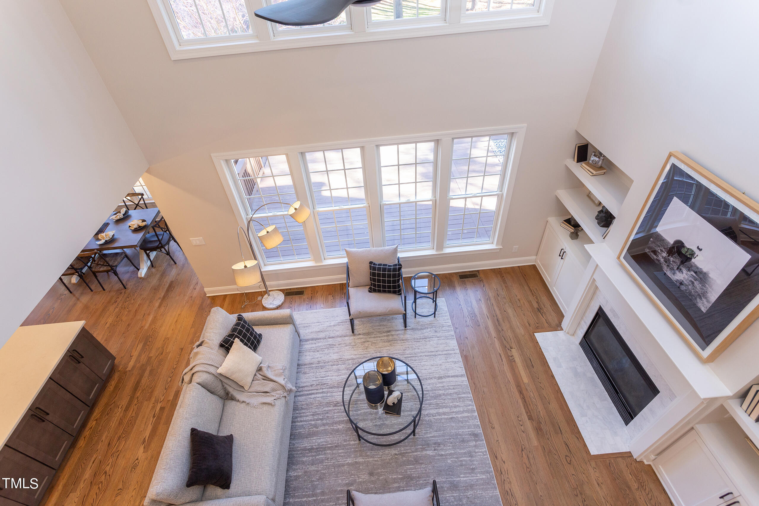737 Loch Highlands Drive Raleigh, NC 27606 - Photo 33 of 85 a living room with furniture and a floor to ceiling window