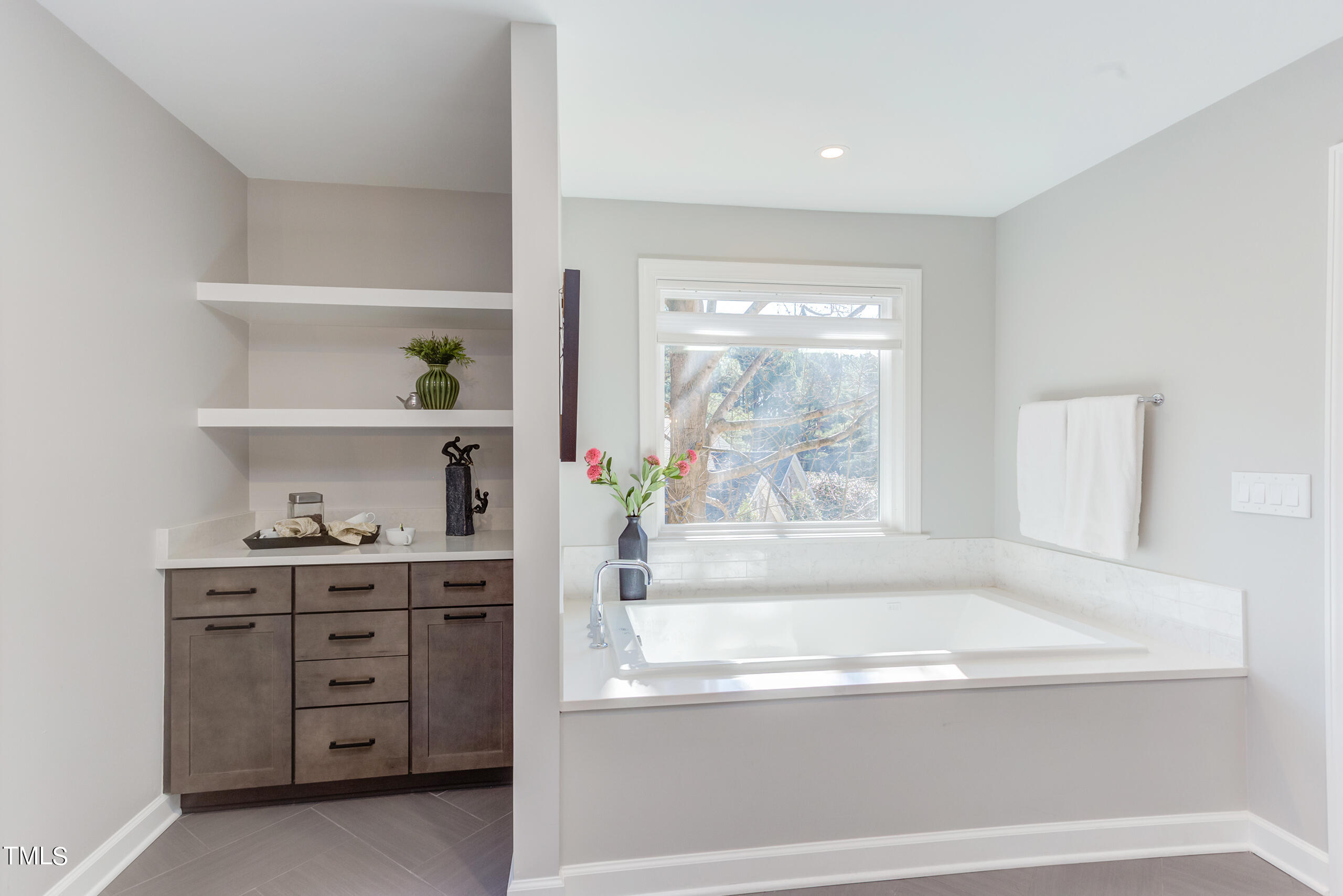 737 Loch Highlands Drive Raleigh, NC 27606 - Photo 46 of 85 a bathroom with a bathtub and a window