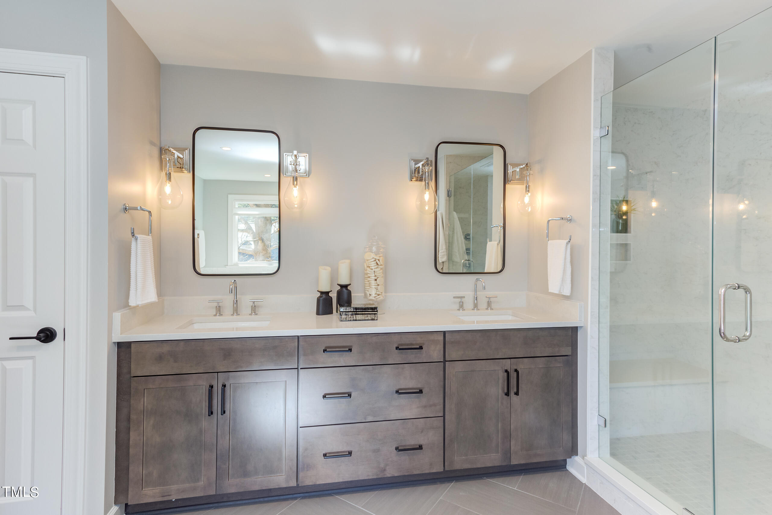 737 Loch Highlands Drive Raleigh, NC 27606 - Photo 47 of 85 a bathroom with a double vanity sink and mirror with shower