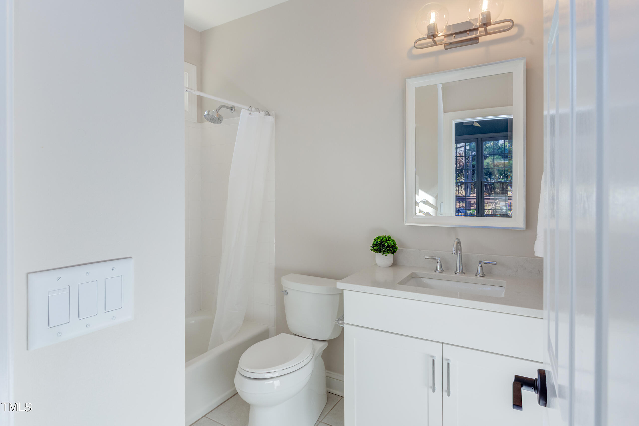 737 Loch Highlands Drive Raleigh, NC 27606 - Photo 51 of 85 a bathroom with a sink toilet and mirror