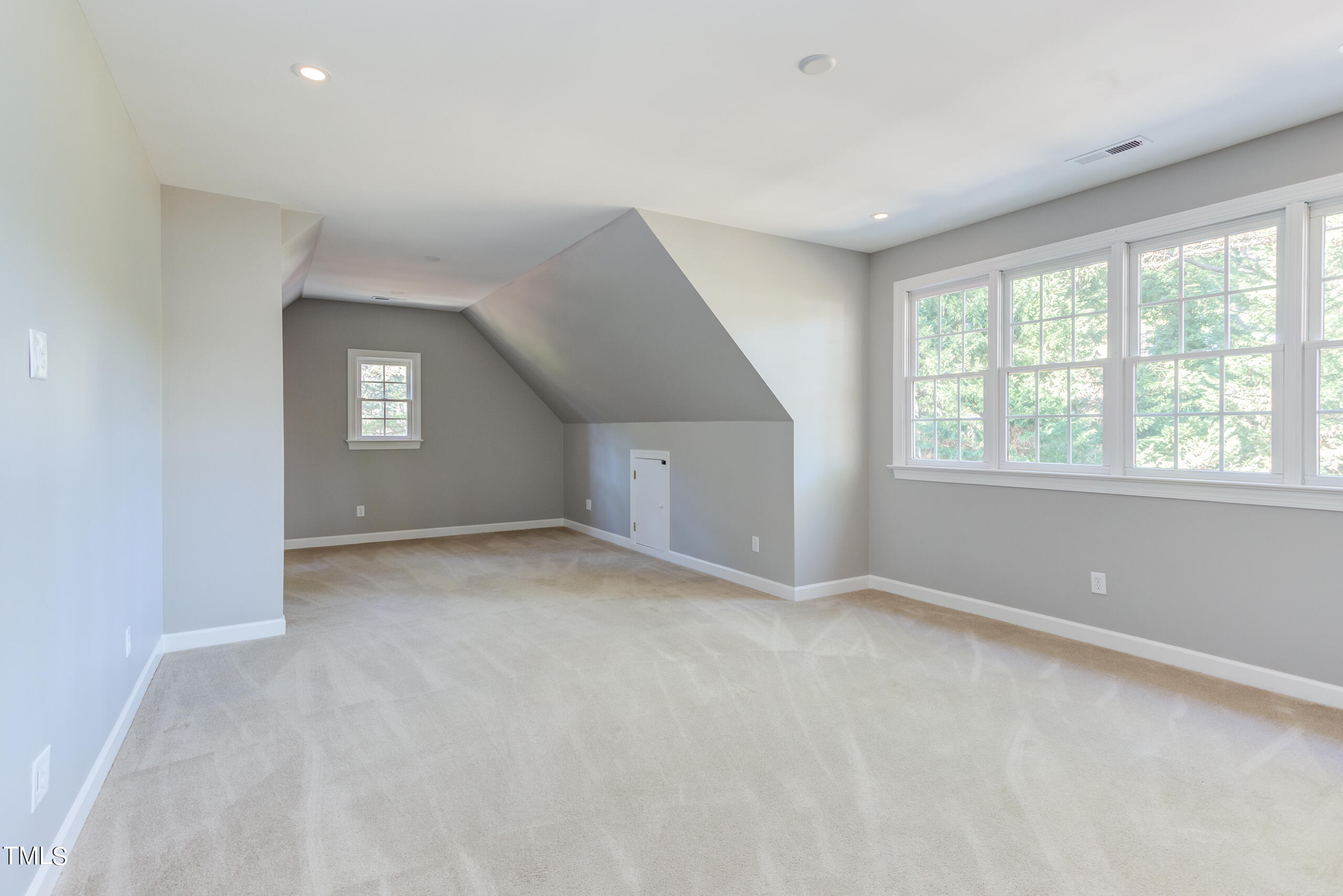 737 Loch Highlands Drive Raleigh, NC 27606 - Photo 57 of 85 a view of an empty room with a window