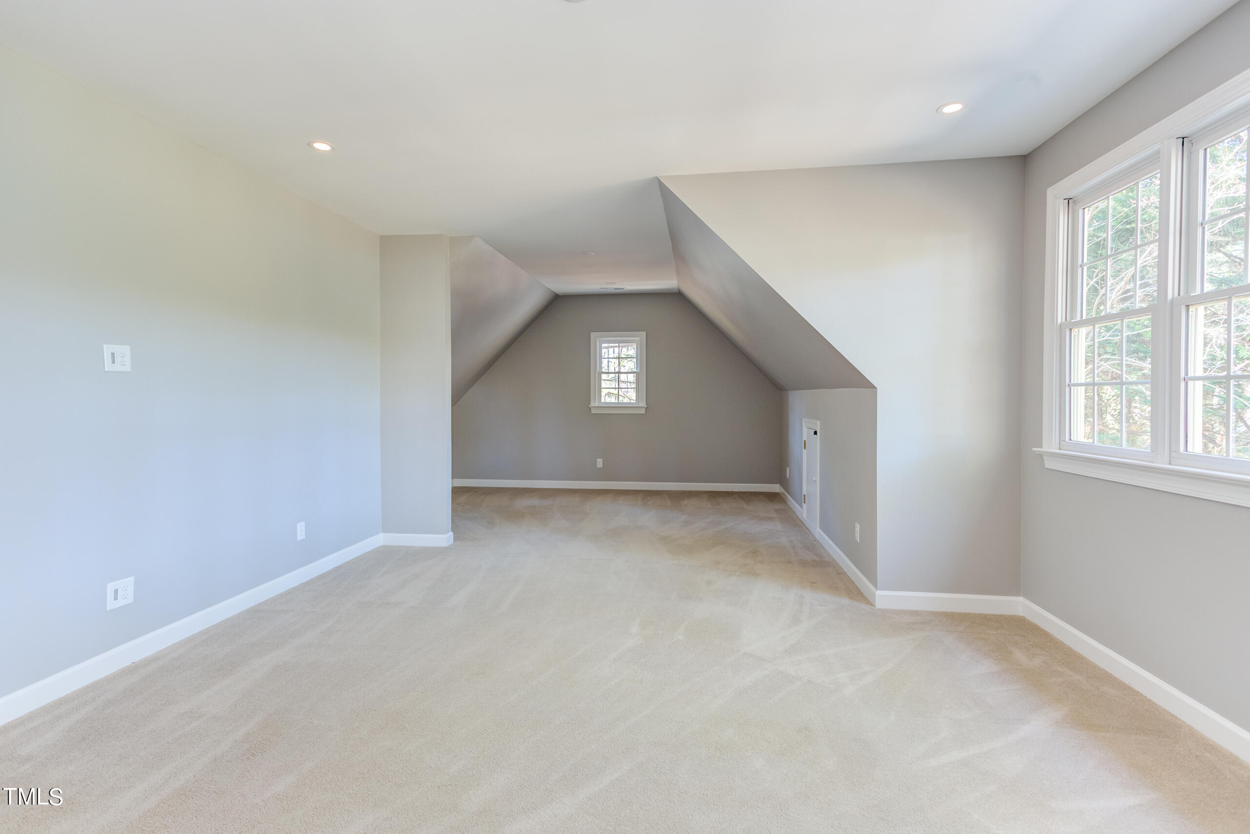 737 Loch Highlands Drive Raleigh, NC 27606 - Photo 58 of 85 an empty room with a empty space and windows