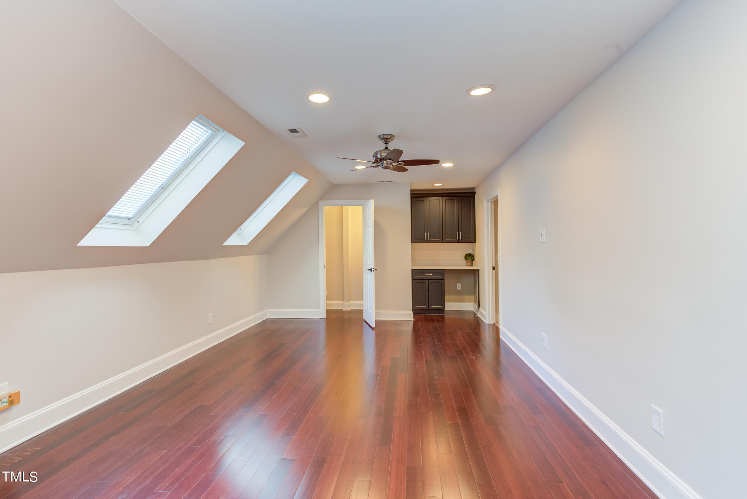 737 Loch Highlands Drive Raleigh, NC 27606 - Photo 60 of 85 a view of empty room with wooden floor
