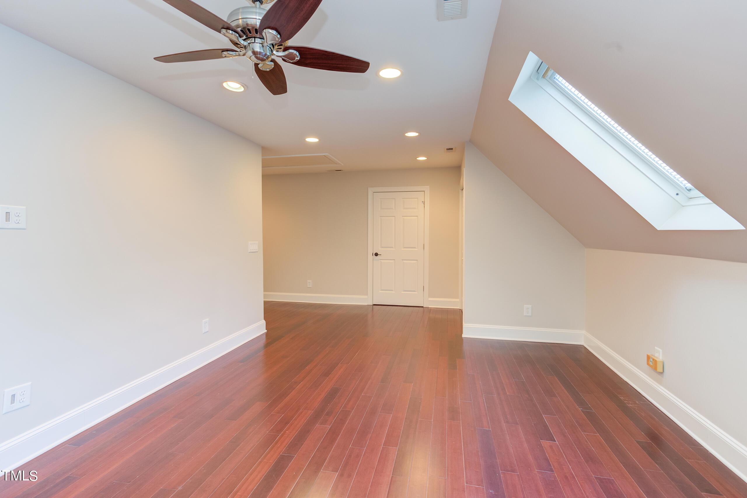 737 Loch Highlands Drive Raleigh, NC 27606 - Photo 63 of 85 wooden floor in an empty room with a window