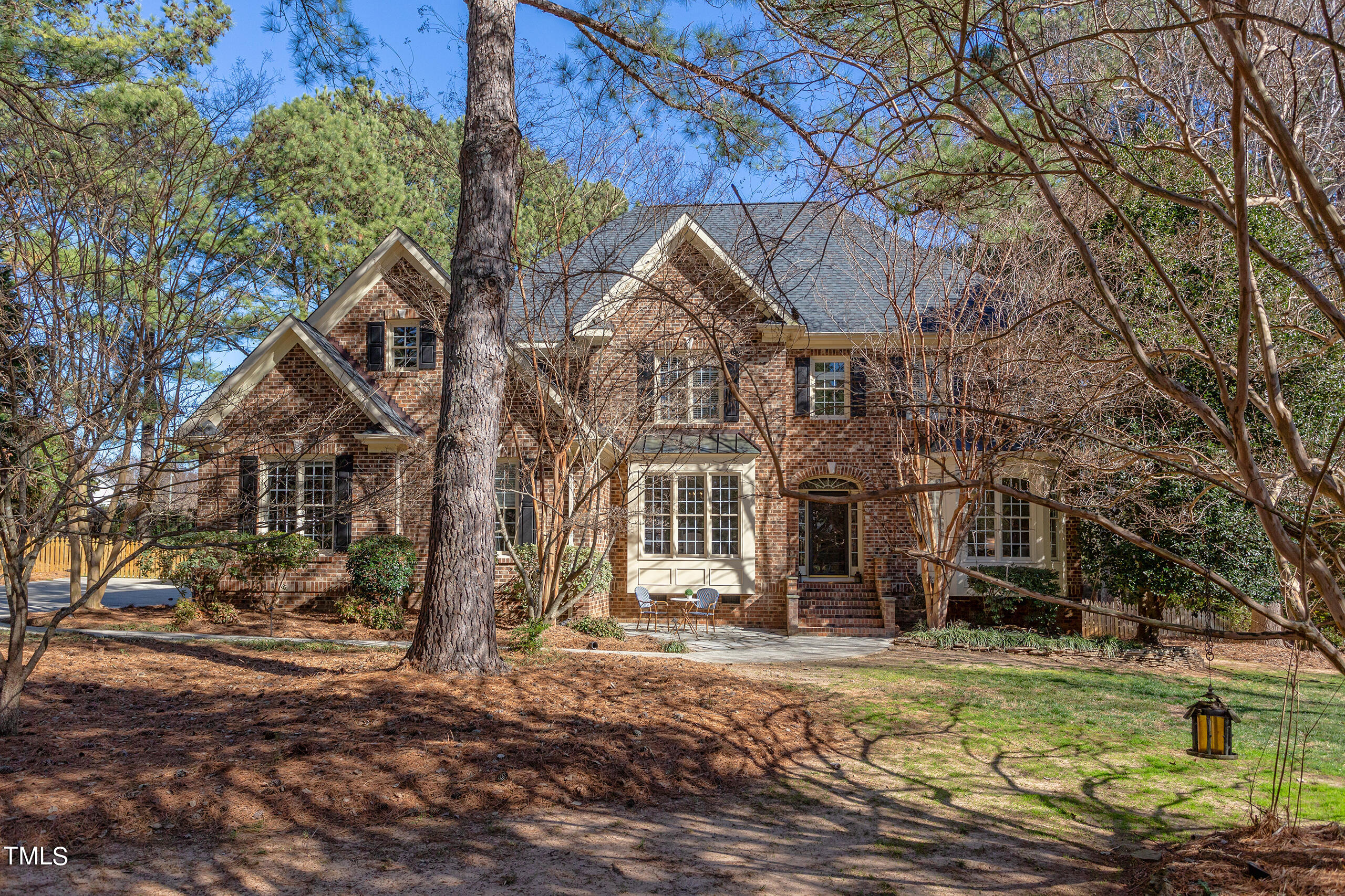 737 Loch Highlands Drive Raleigh, NC 27606 - Photo 66 of 85 a front view of a house with a yard