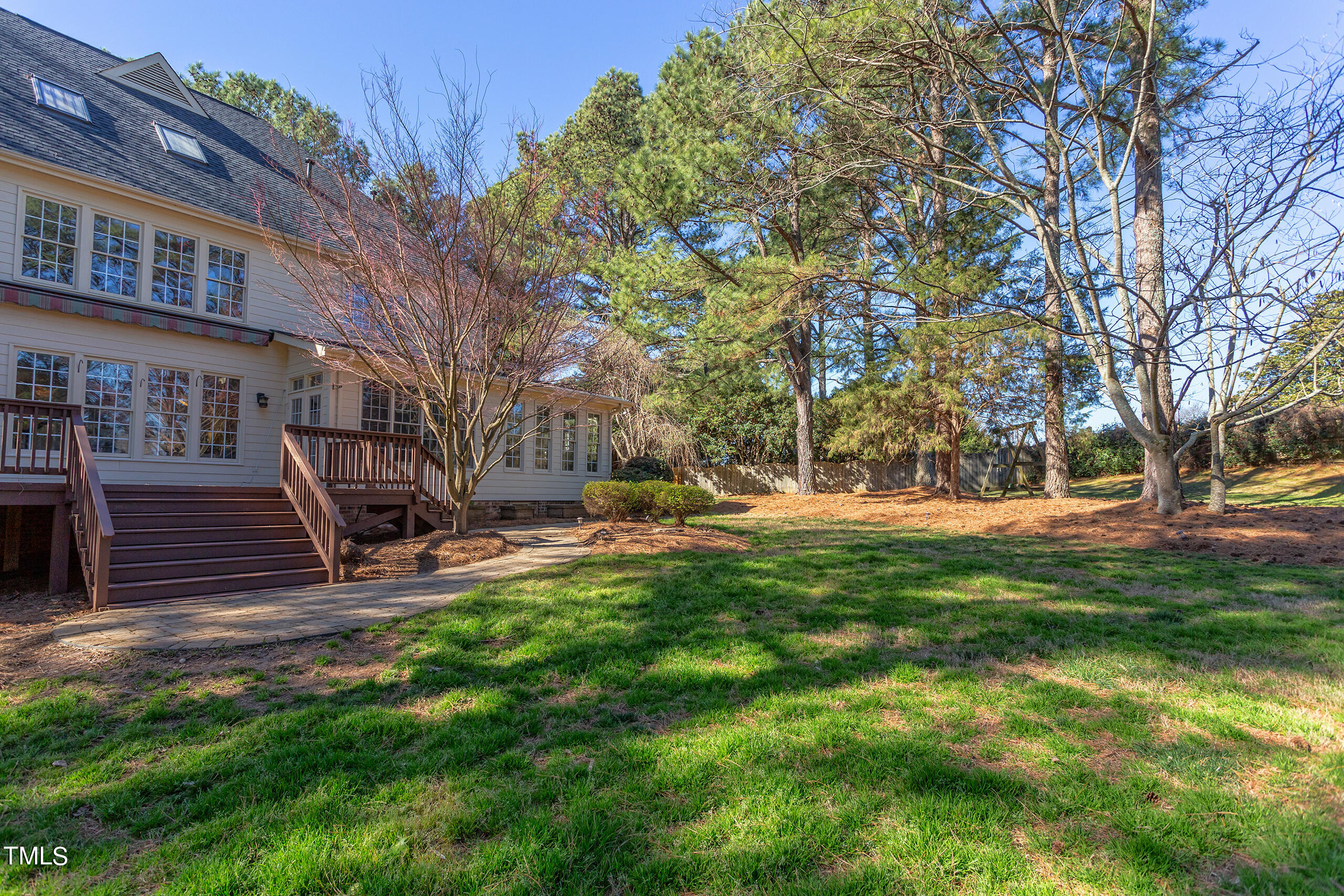 737 Loch Highlands Drive Raleigh, NC 27606 - Photo 77 of 85 a view of backyard with a table and chairs