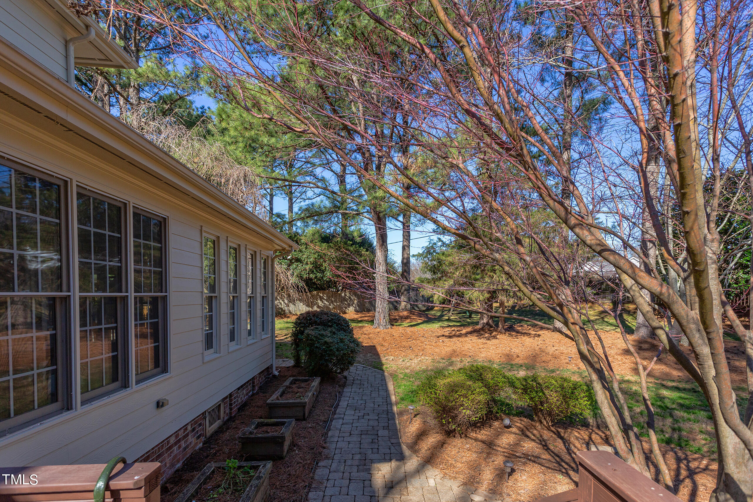 737 Loch Highlands Drive Raleigh, NC 27606 - Photo 78 of 85 a view of a backyard with a large tree