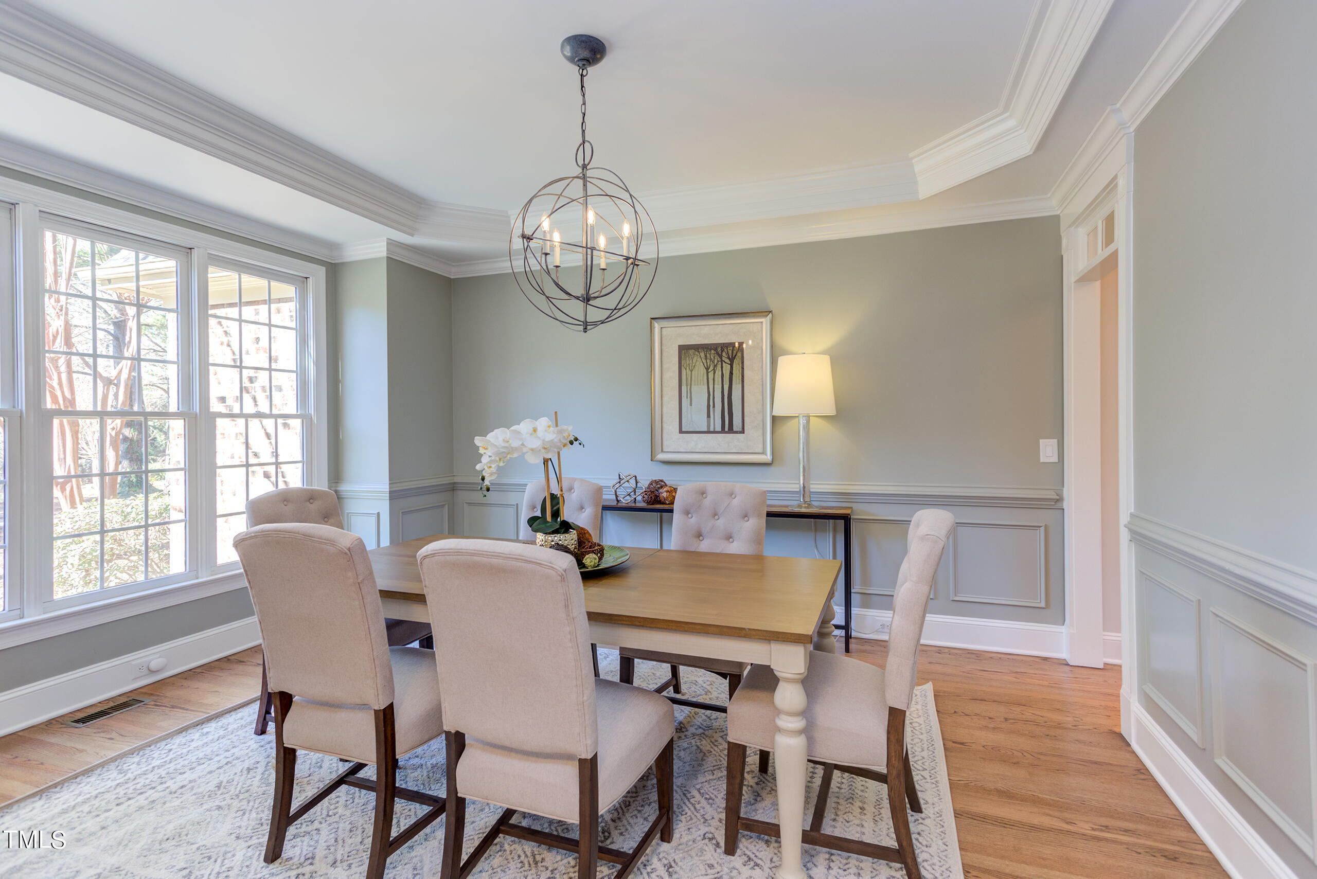 737 Loch Highlands Drive Raleigh, NC 27606 - Photo 10 of 85 a view of a dining room with furniture window and wooden floor