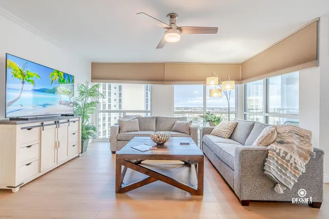 a living room with furniture and a large window