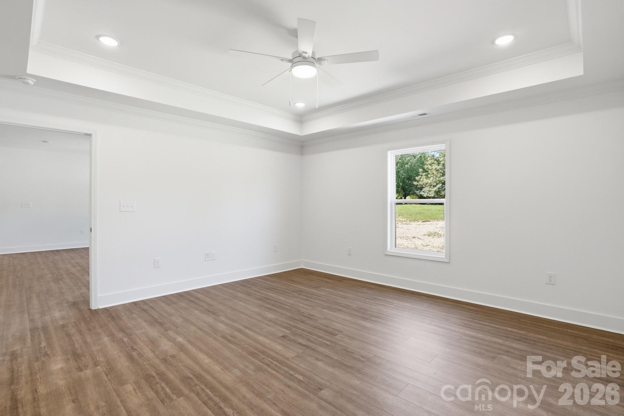 339 Peachtree Road Rock Hill, SC 29730 - Photo 21 of 39 an empty room with wooden floor and windows