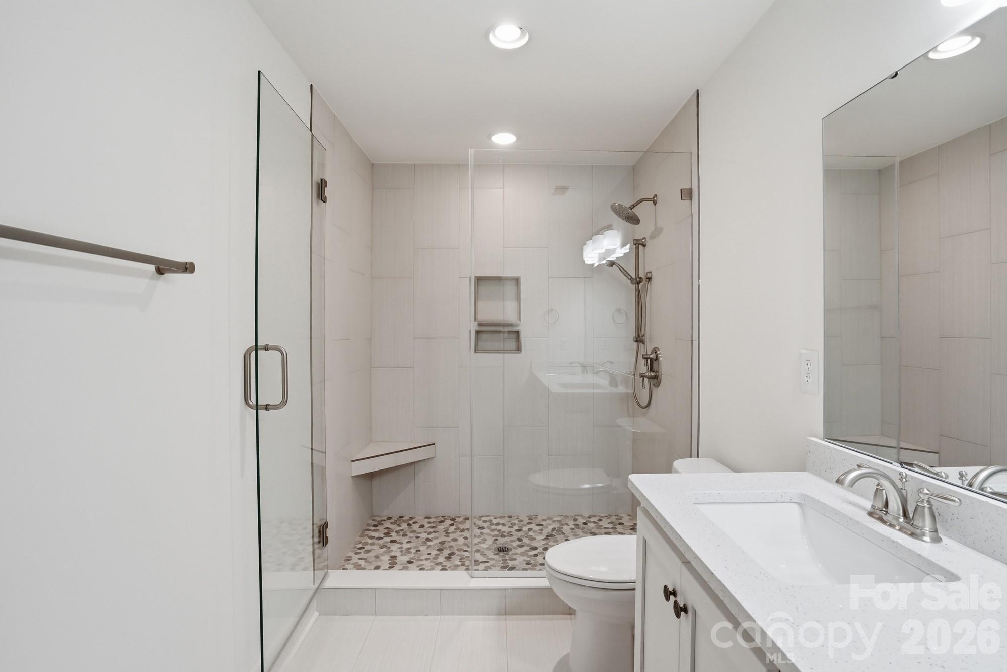 339 Peachtree Road Rock Hill, SC 29730 - Photo 23 of 39 a bathroom with a granite countertop sink a toilet and shower