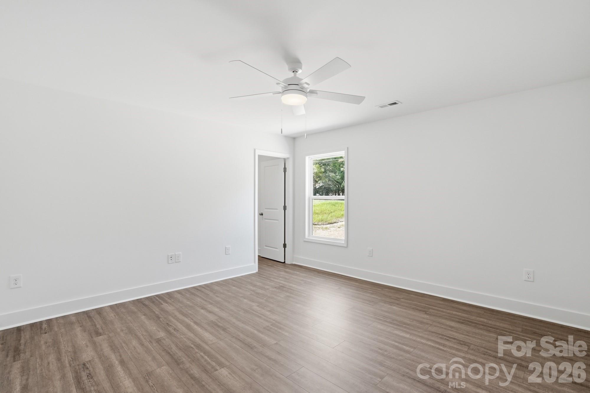 339 Peachtree Road Rock Hill, SC 29730 - Photo 24 of 39 an empty room with wooden floor and windows