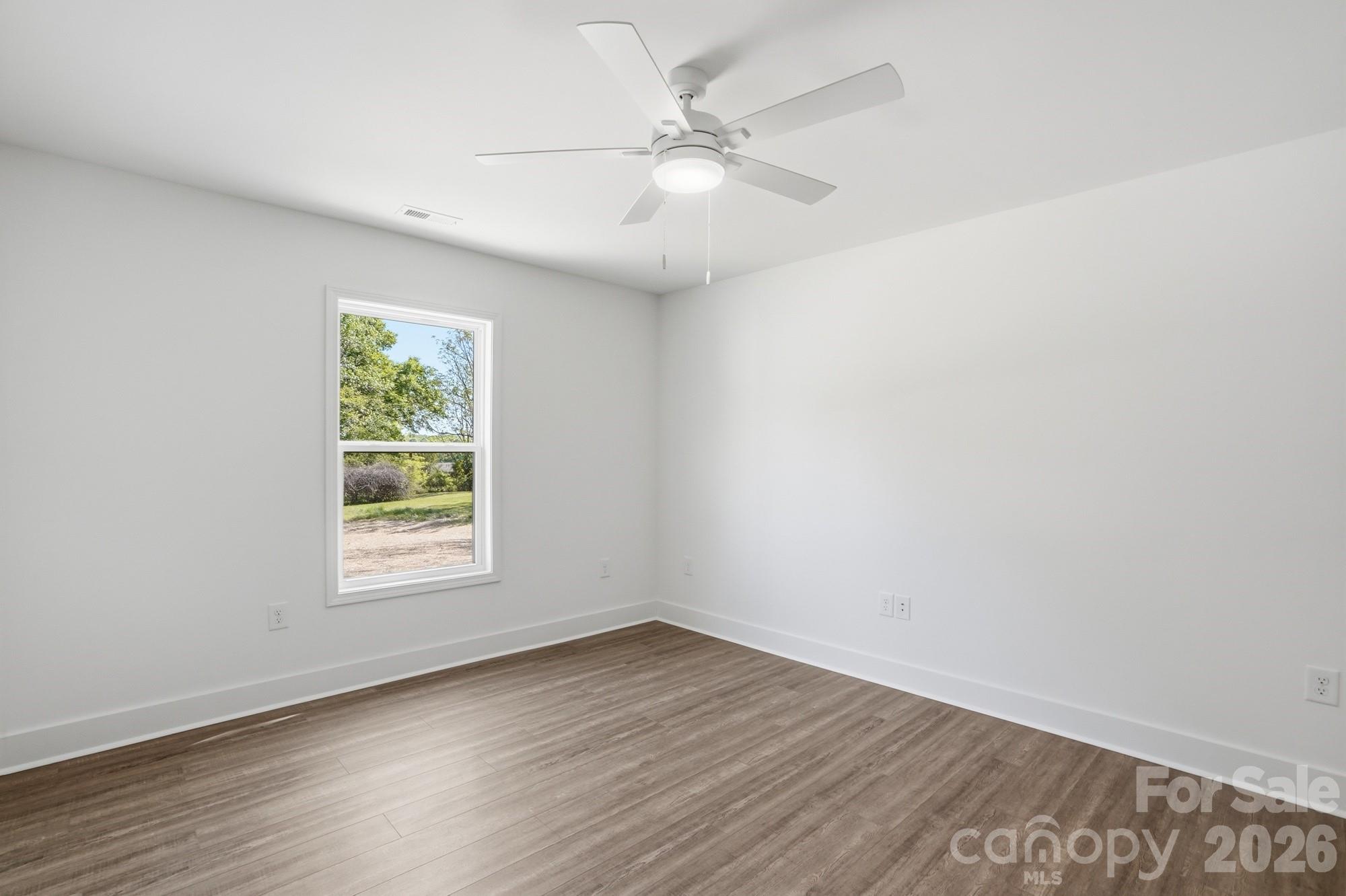 339 Peachtree Road Rock Hill, SC 29730 - Photo 27 of 39 an empty room with wooden floor and windows