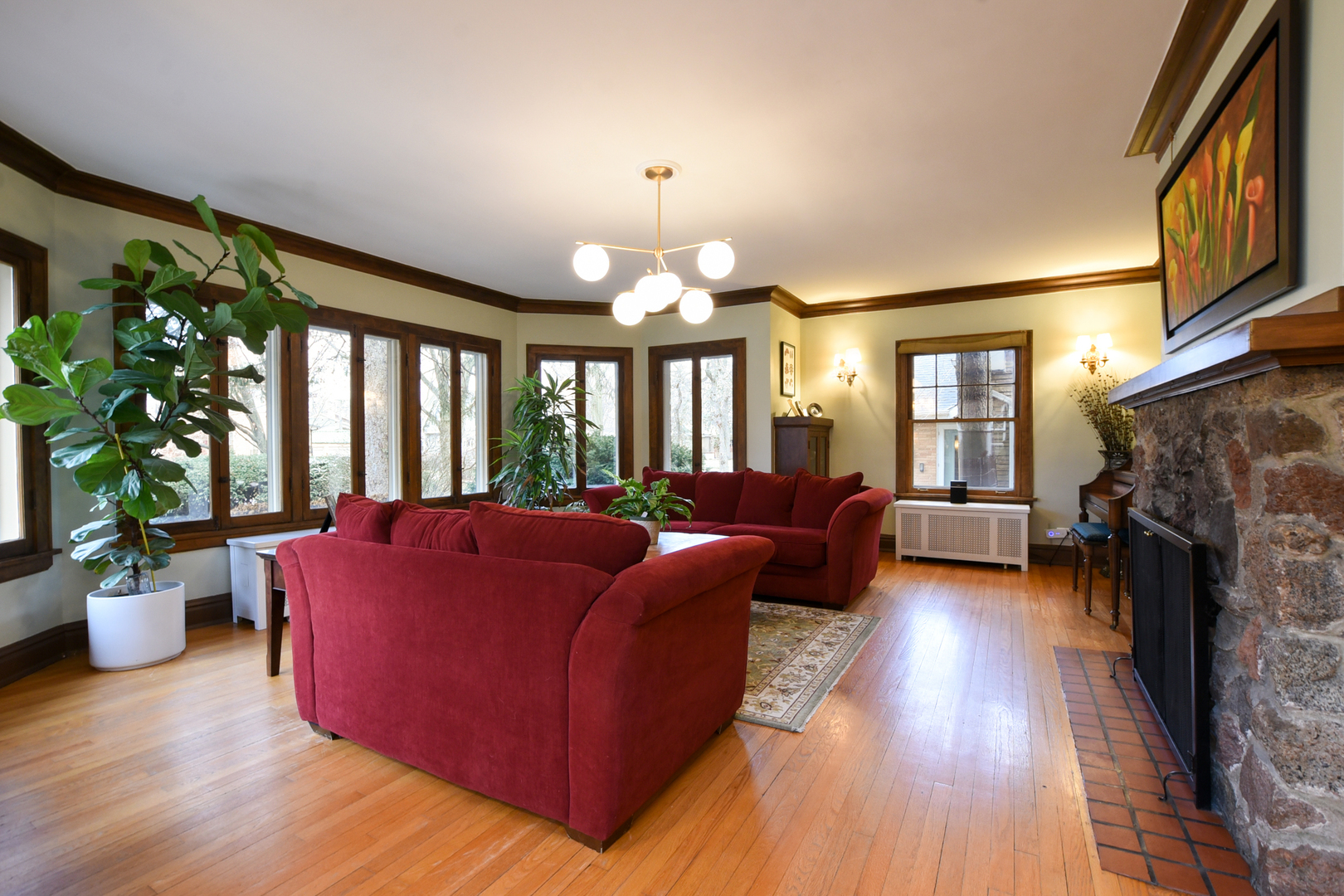 328 Olmsted Road Riverside, IL 60546 - Photo 3 of 45 a living room with furniture a fireplace and a potted plant