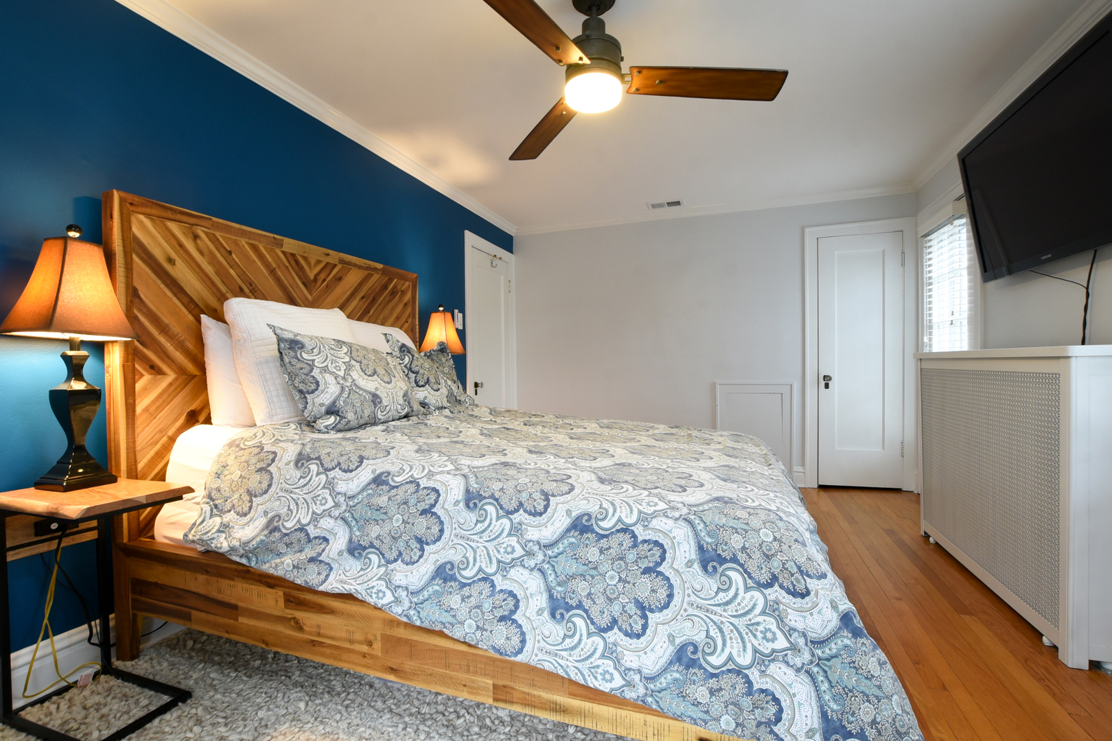 328 Olmsted Road Riverside, IL 60546 - Photo 34 of 45 a bedroom with a bed and a flat screen tv