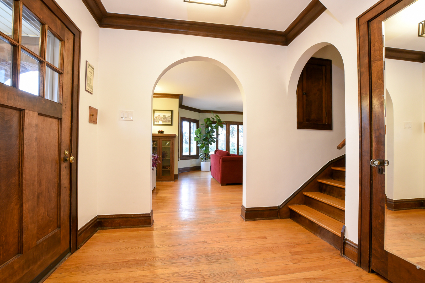 328 Olmsted Road Riverside, IL 60546 - Photo 7 of 45 a view of entryway and hall with wooden floor