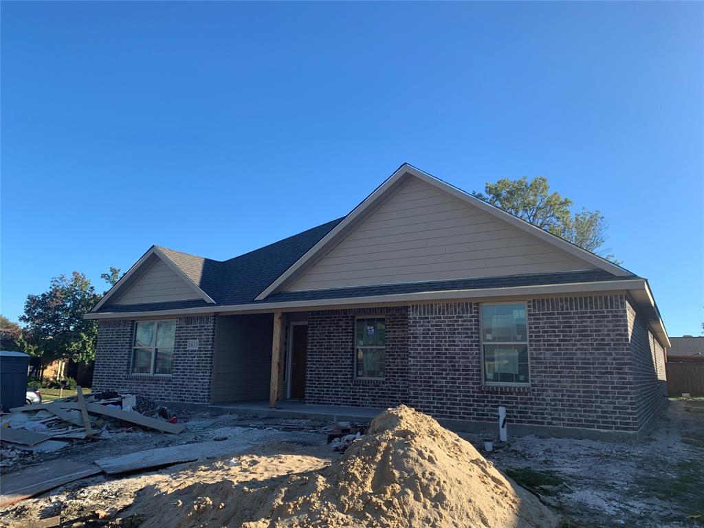 1833 Sandy Ridge Court Carrollton, TX 75007 - Photo 1 of 1 a front view of a house with a yard
