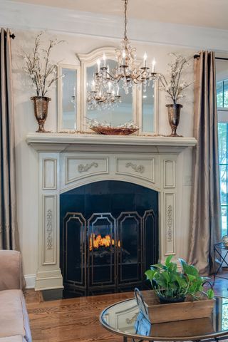 a front view of a fireplace with wooden floor