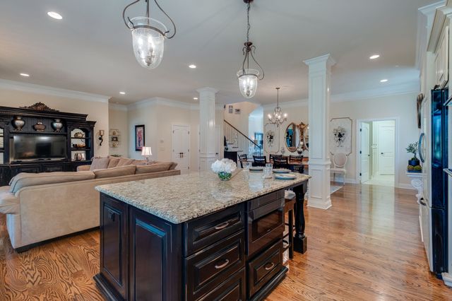 an open kitchen with a table and chairs