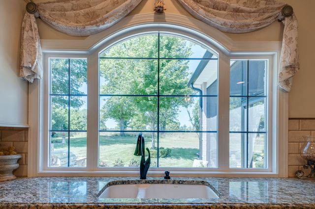 a living room with a large window and couch