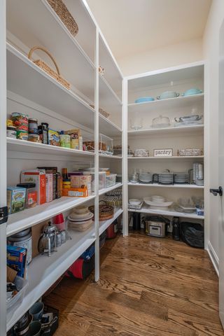 a living room with furniture and a book shelf