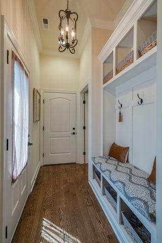 a view of living room with furniture and wooden floor