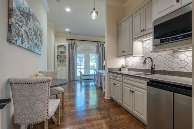 a kitchen with granite countertop lots of counter top space
