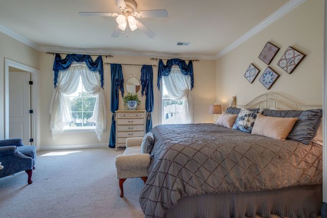 a bedroom with a bed and a couch