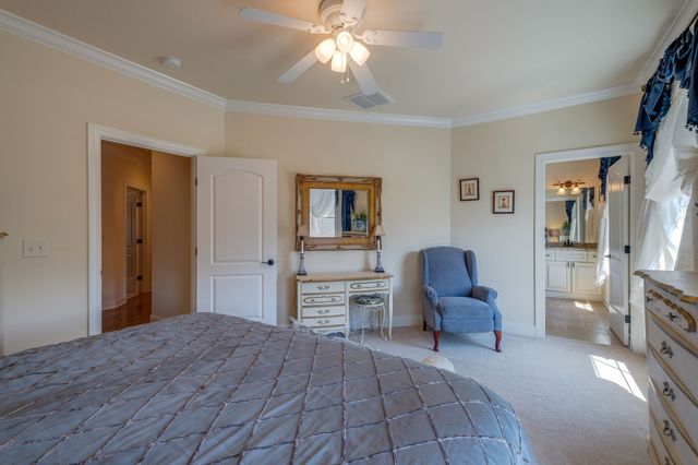 a bedroom with furniture and a window