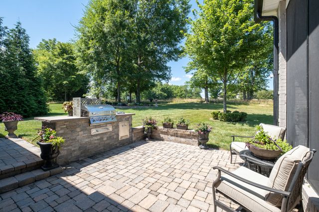 a view of a water fountain with an outdoor seating
