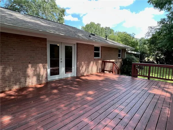 a view of deck with a trees
