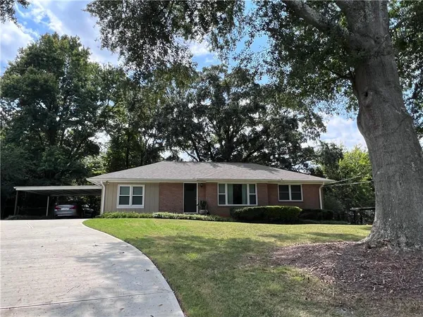 a front view of house with yard porch and green space