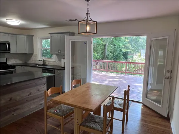 a kitchen with a table and chairs in it