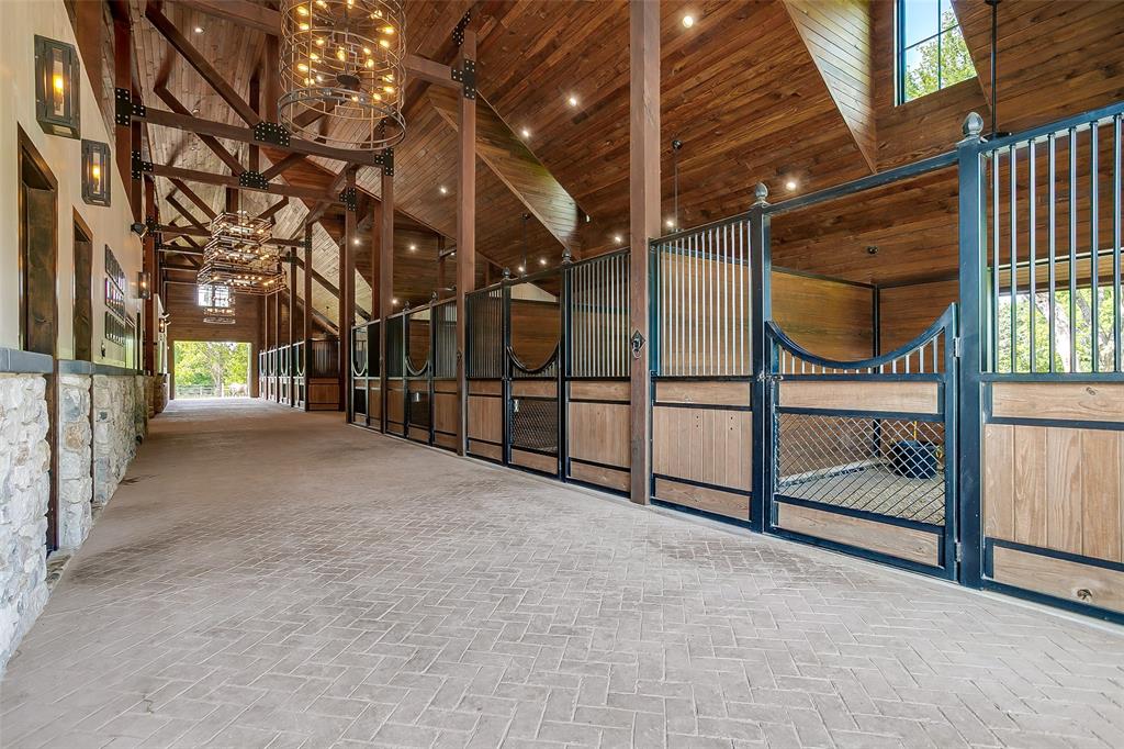 5000 T W King Road Southlake, TX 76092 - Photo 8 of 40 Stamped concrete alleys throughout the barn, crafted for both form and durability.