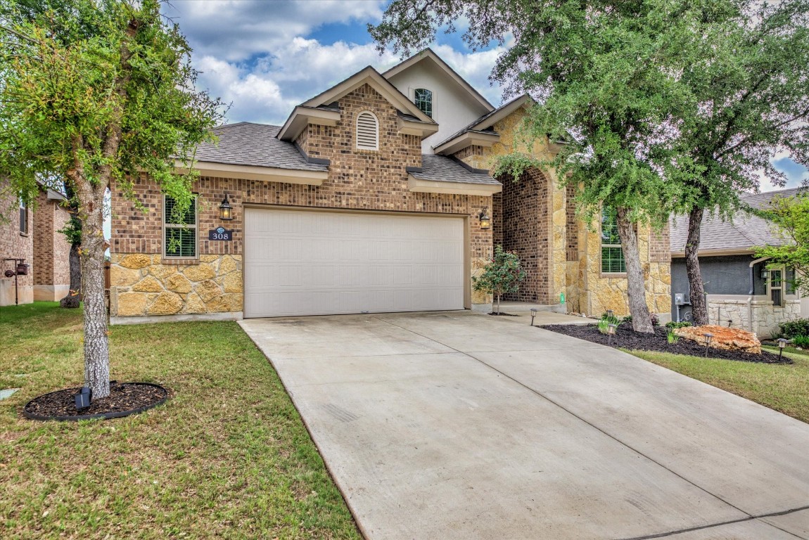 308 Cross Mountain Trail Georgetown, TX 78628 - Photo 1 of 1 a front view of a house with a yard