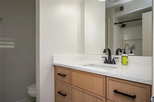 a bathroom with a sink a tub and a shower