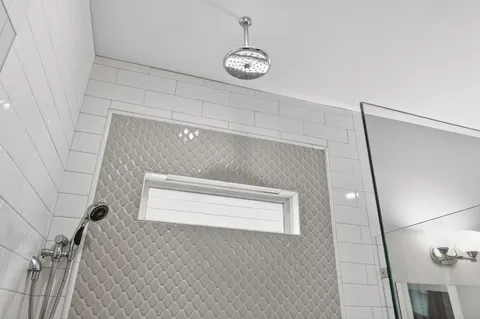 a bathroom with a shower and a sink