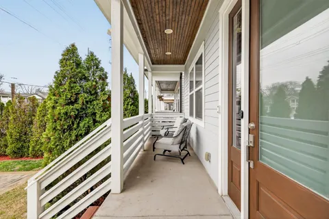 a balcony with view of outdoor space