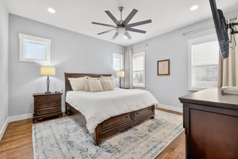 a bedroom with a bed and window